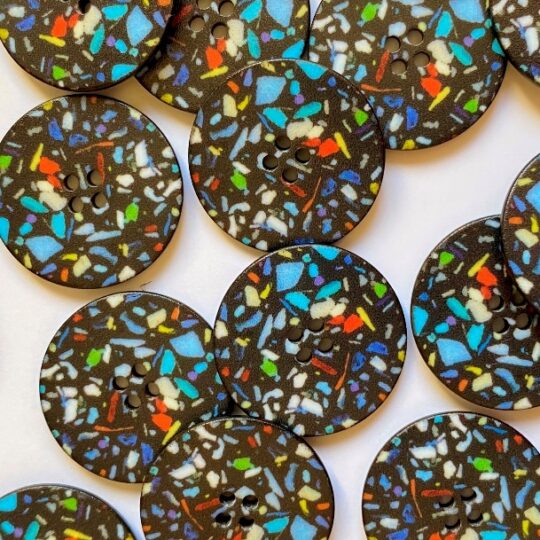 Black buttons with speckles
