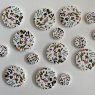 White buttons with speckles