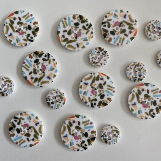 White buttons with speckles
